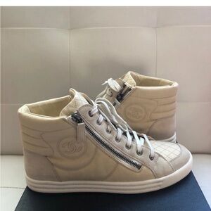 CHANEL Cream Quilted High-Top Sneakers
